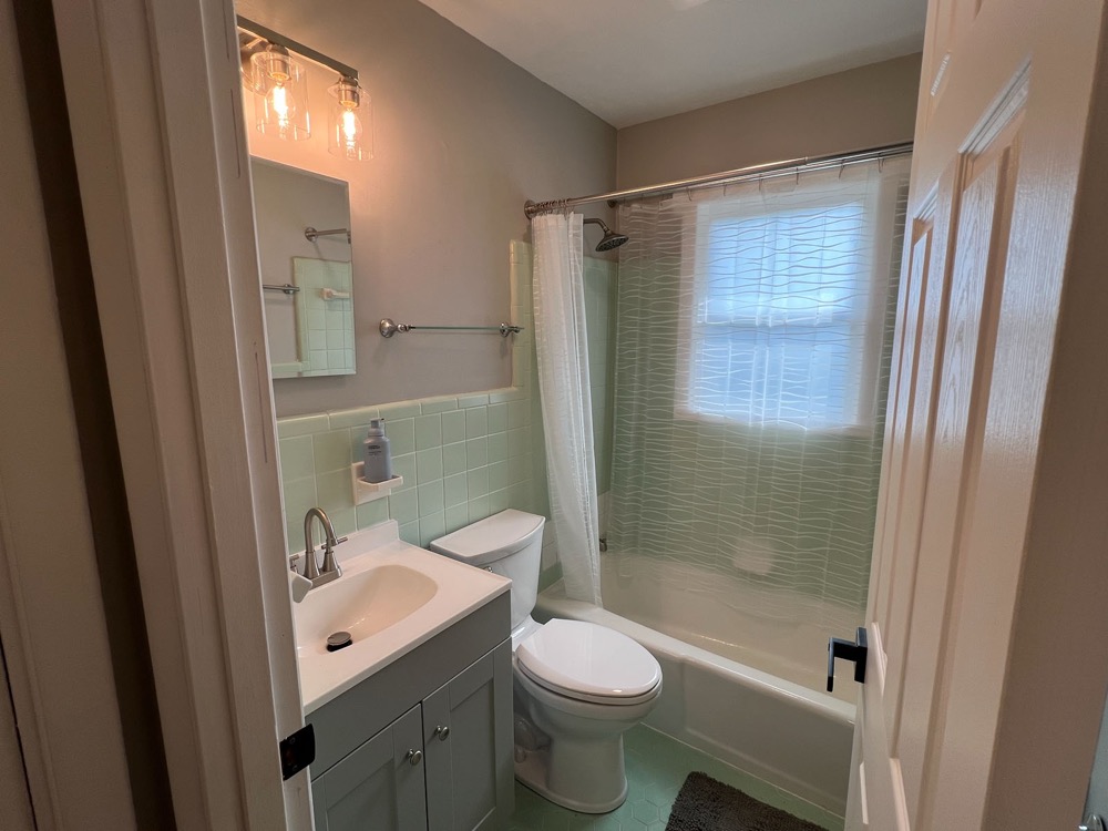 Clean, updated bathroom shared by crew in each apartment